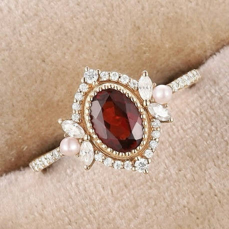 Vintage Oval Shaped Garnet and Pearl Engagement Ring