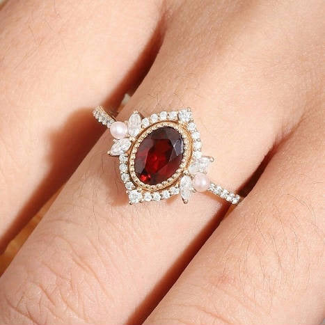 Vintage Oval Shaped Garnet and Pearl Engagement Ring
