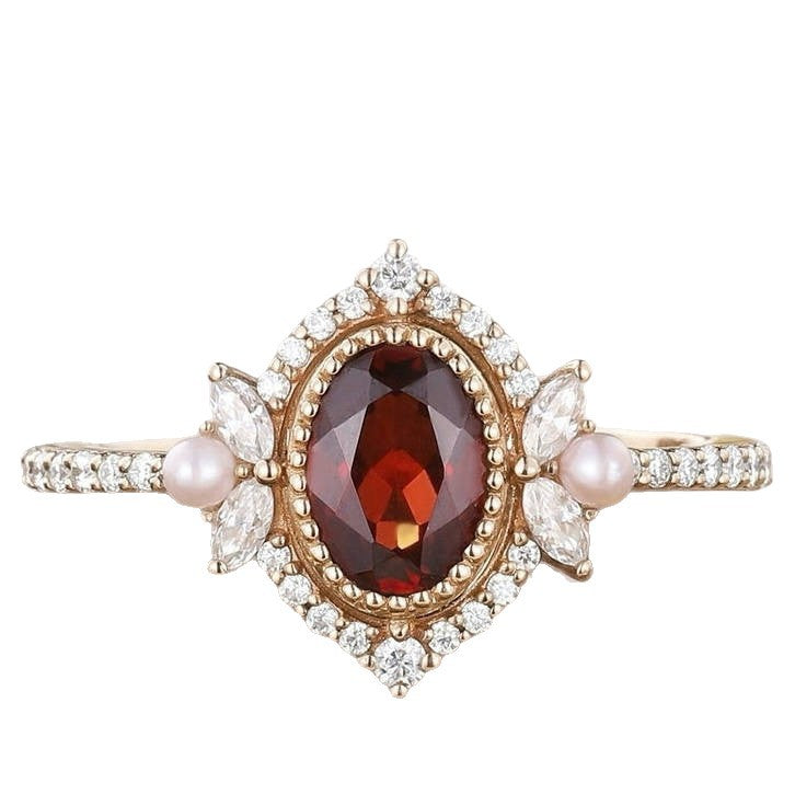 Vintage Oval Shaped Garnet and Pearl Engagement Ring